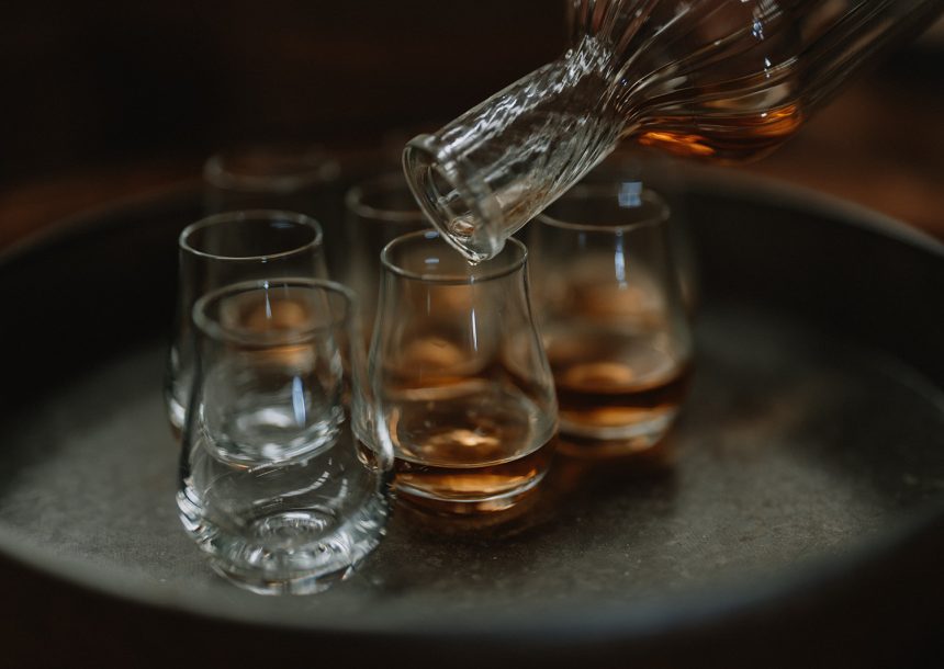 Pouring drams of Wire Works Whisky